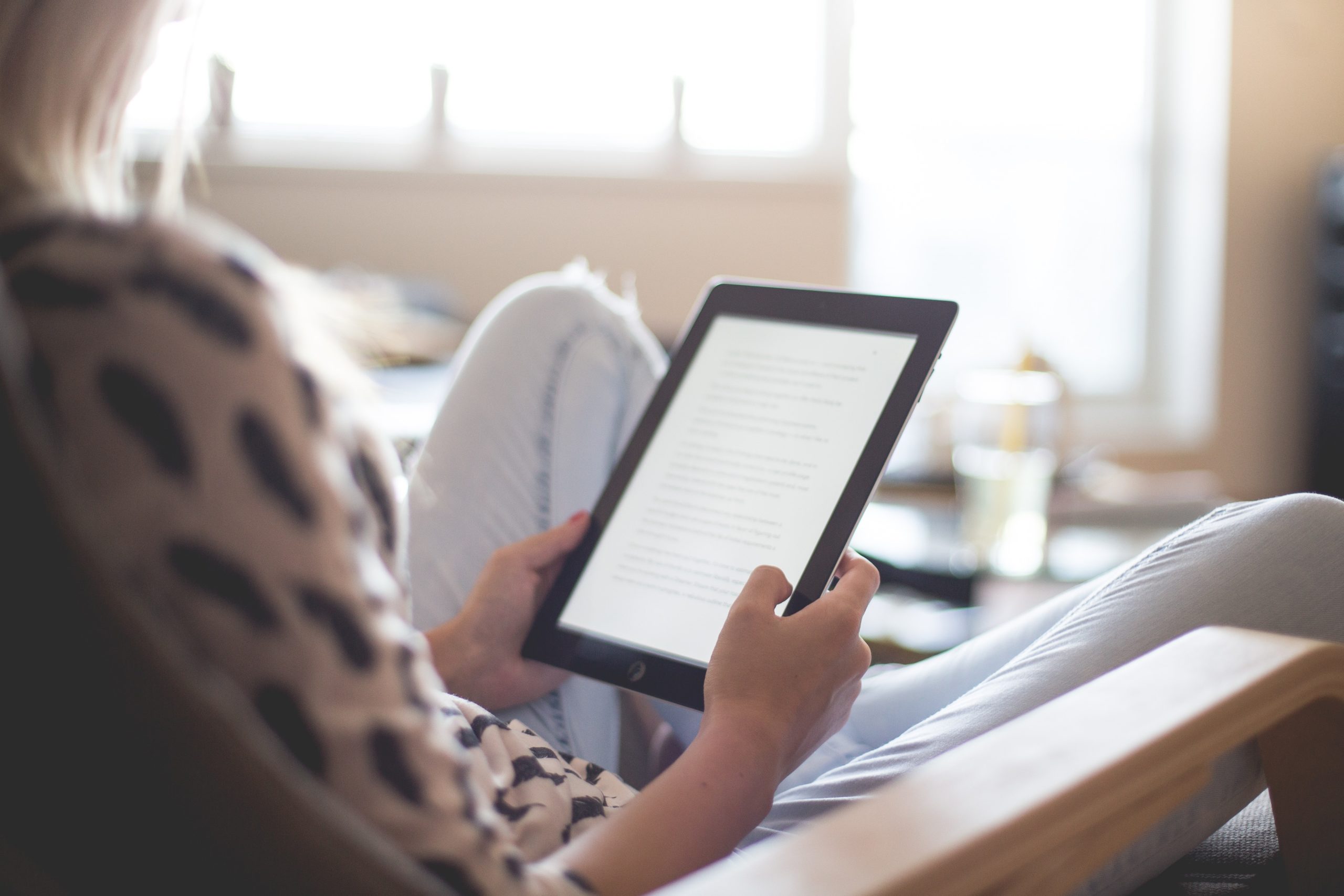 woman reading ipad owasso Homes for Rent