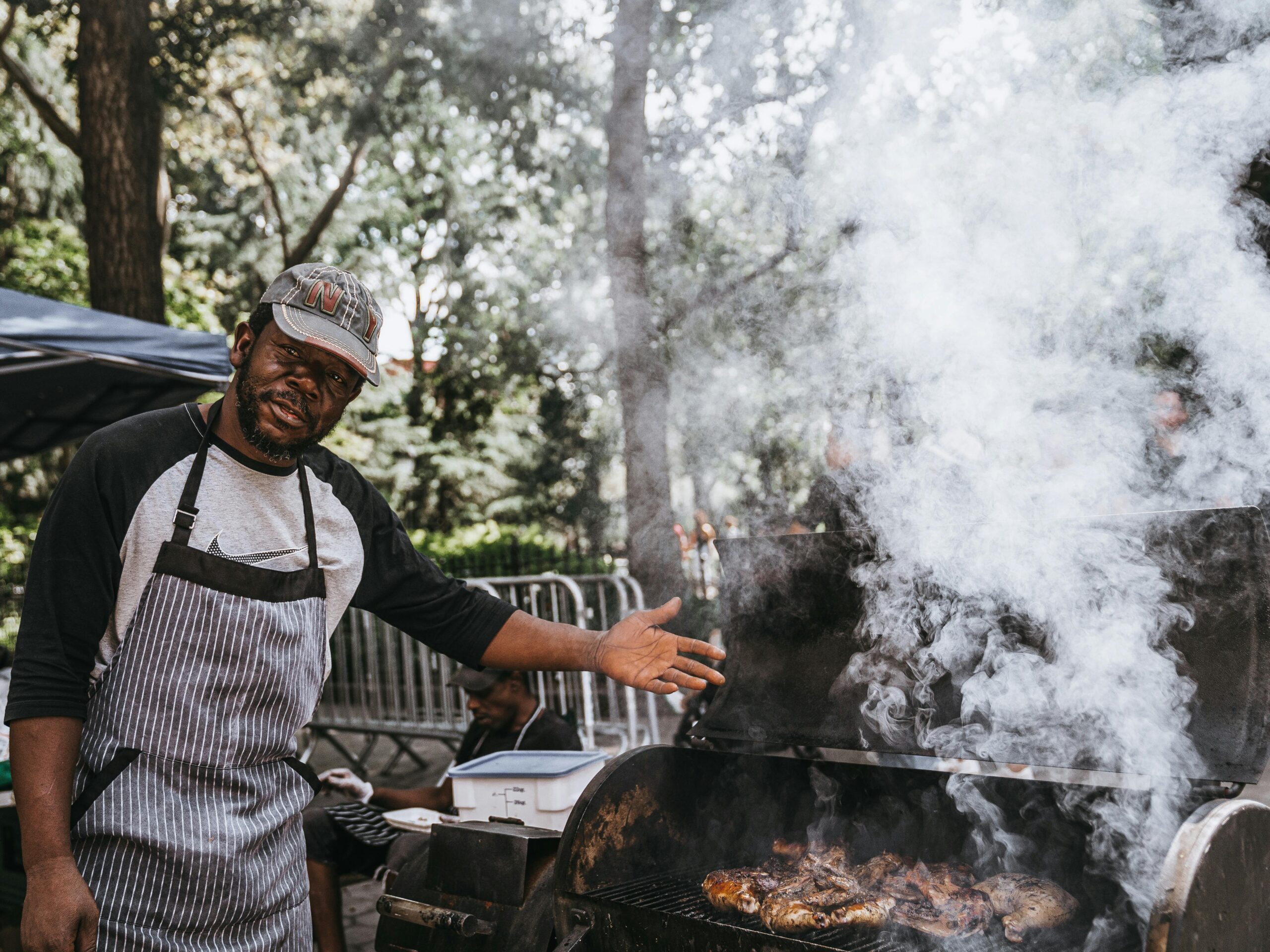 man standing next to smoking grill owasso living blog summer grilling ideas