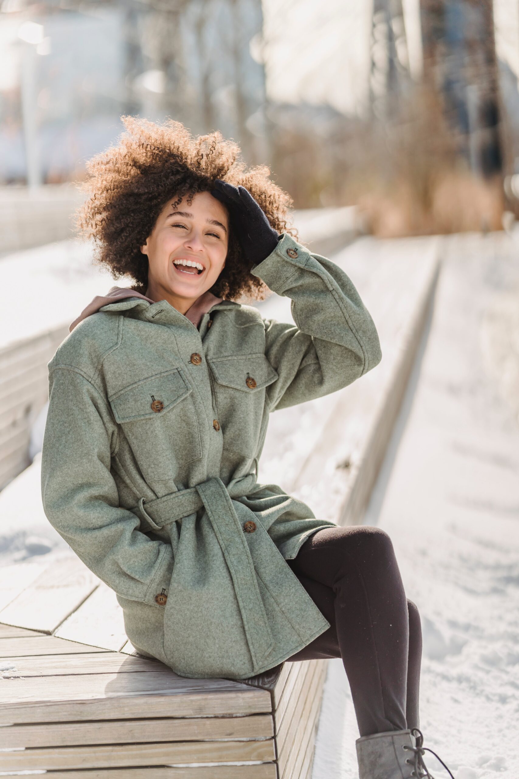 woman smiling outside in winter owasso living blog keeping your resolutions