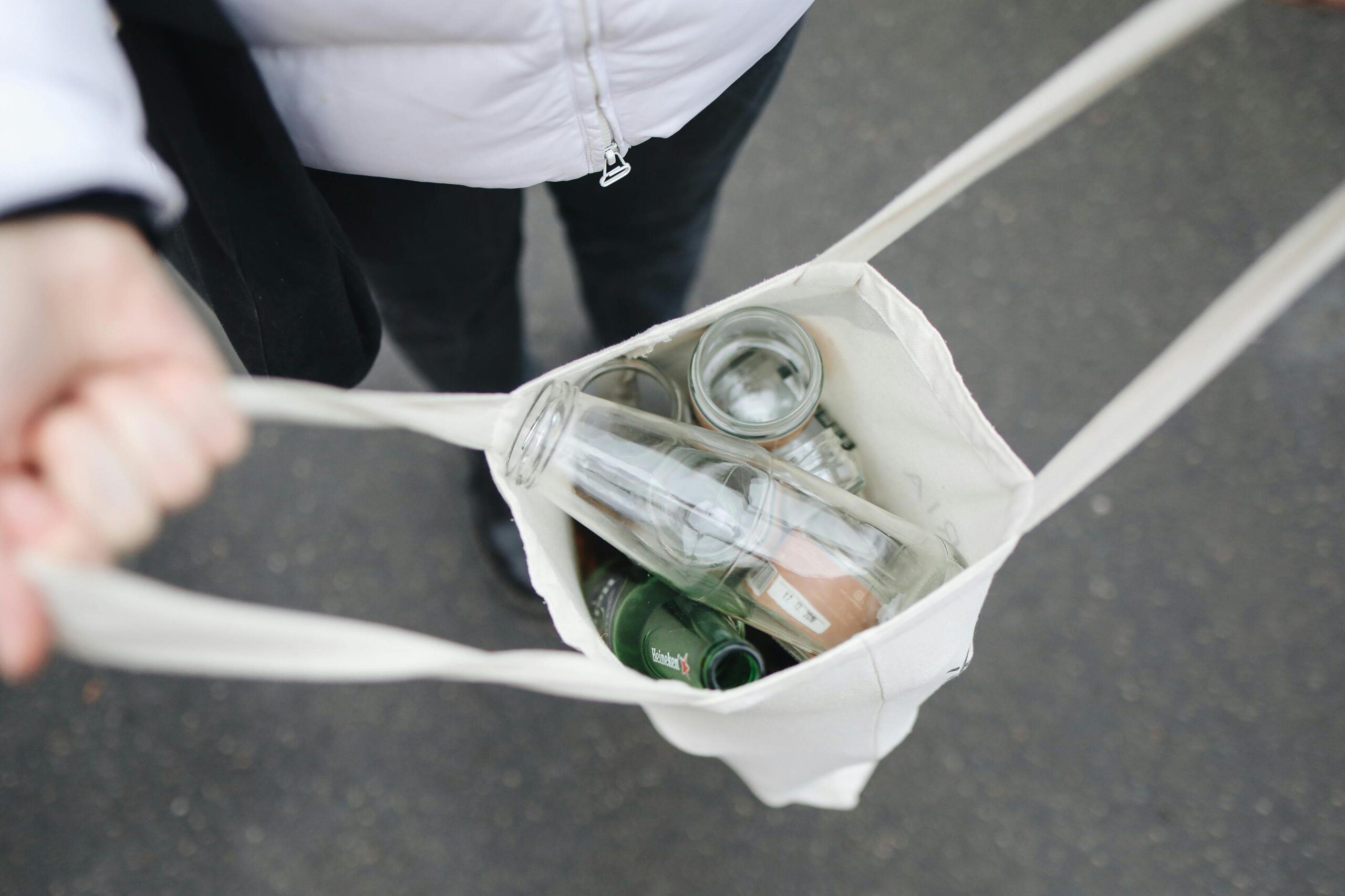 pexels-polina-tankilevitch-3735218 recycling bottles in tote bag legacy living blog