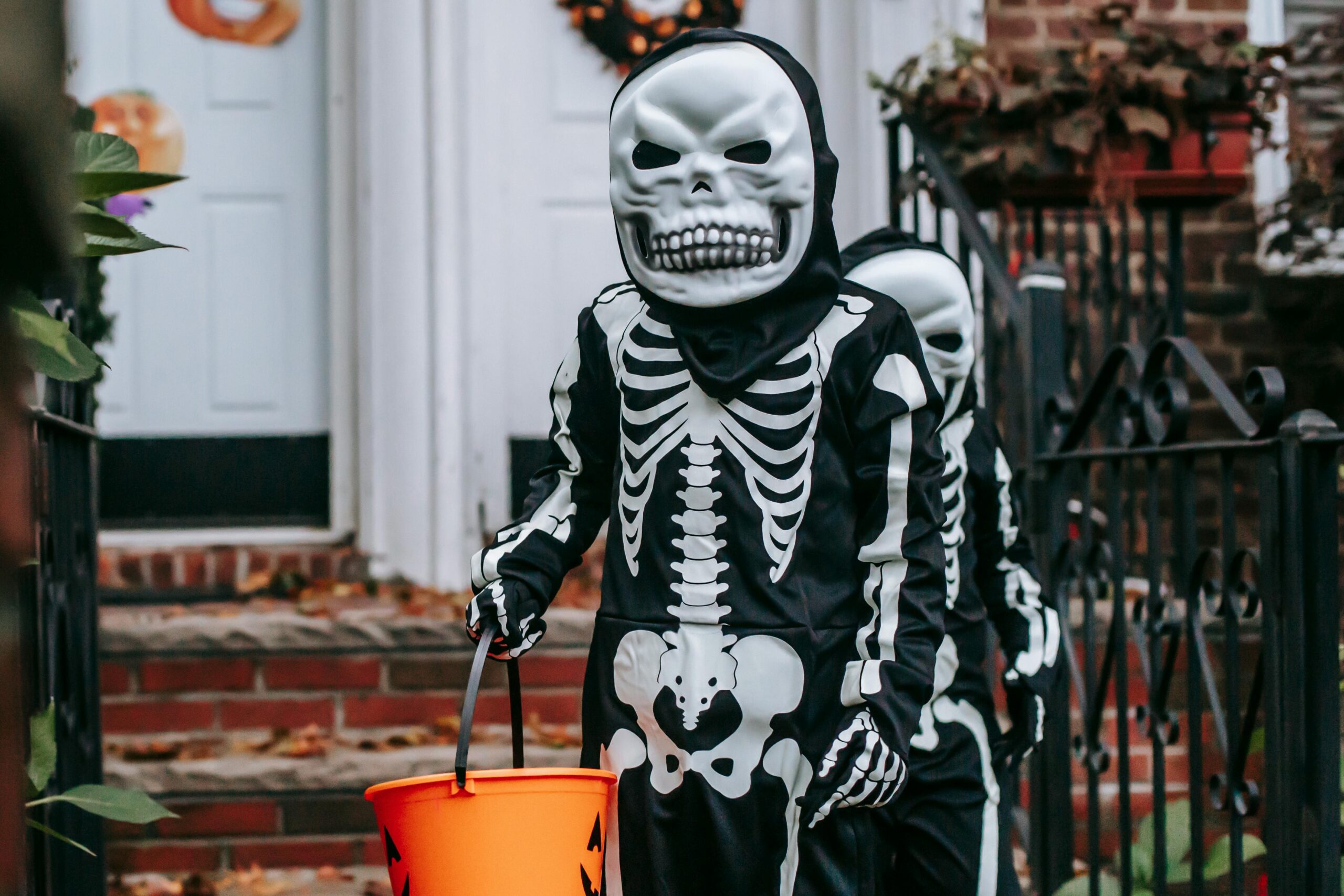 kid in halloween costume legacy living blog halloween decor ideas for front porch
