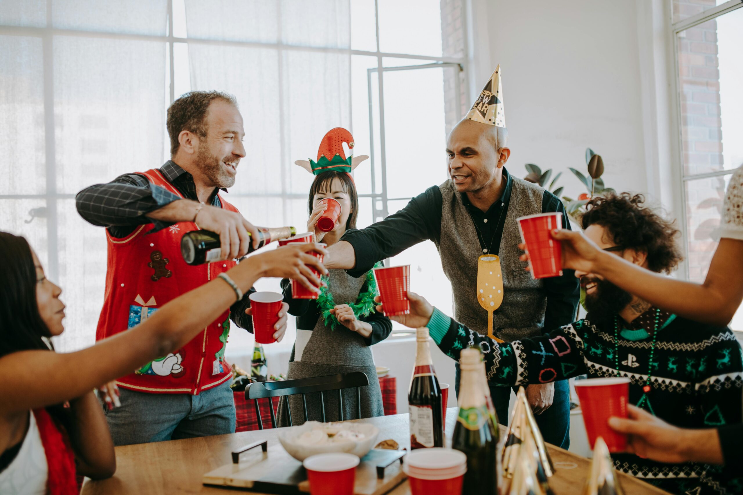 pexels-rdne-6518897 new holiday traditions legacy living blog friends cheers over table