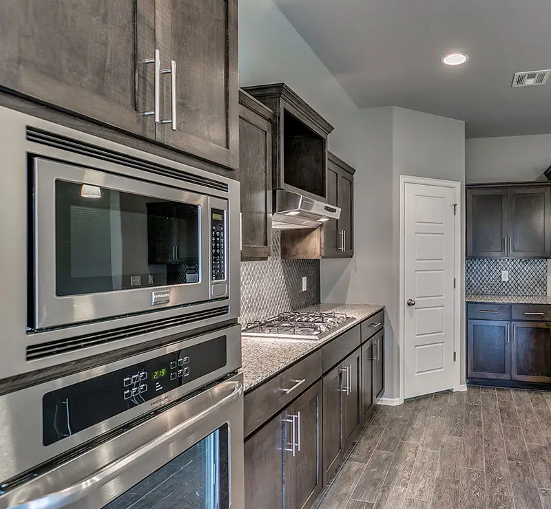 Legacy Living Tulsa rental home kitchen with modern cabinetry and open layout