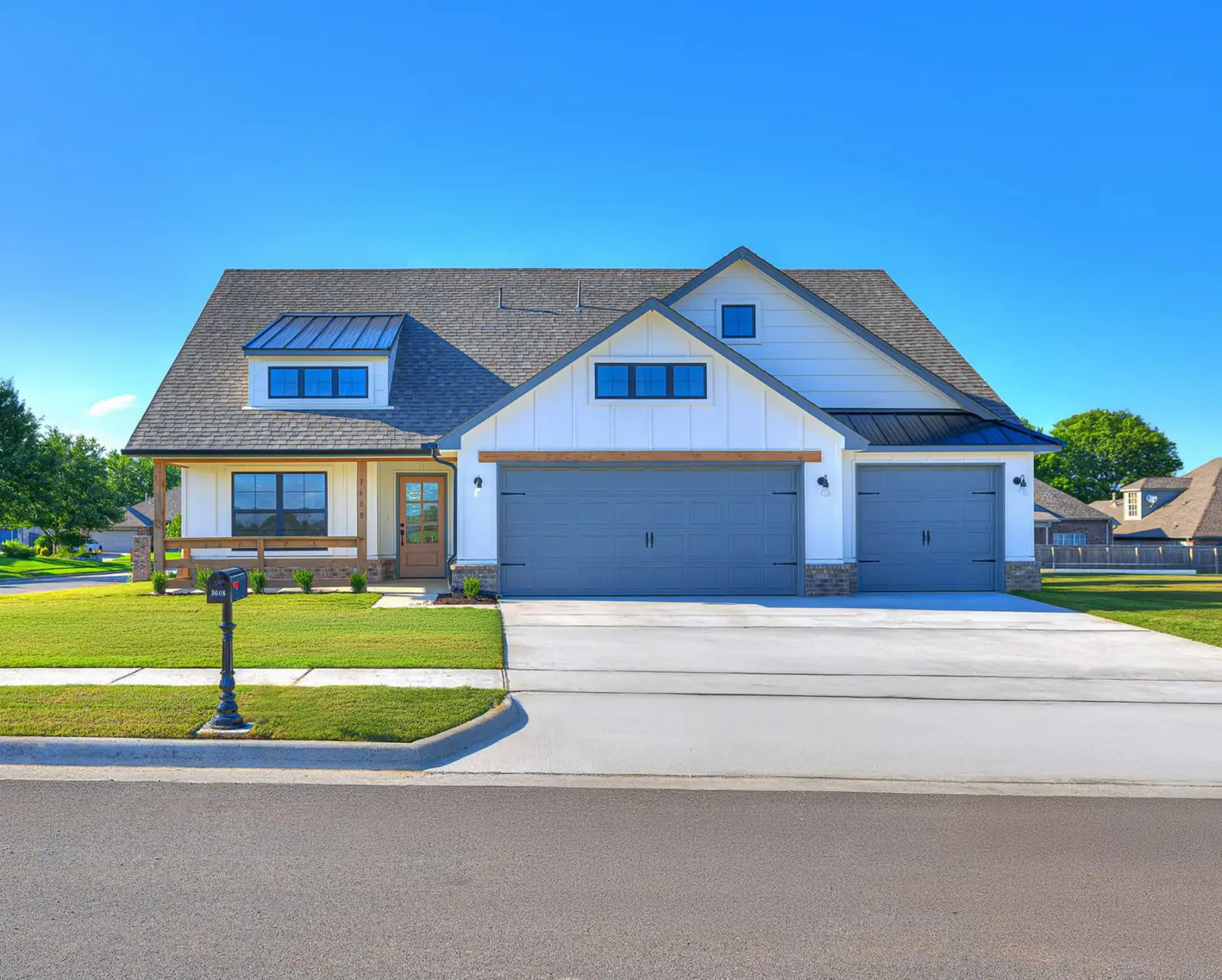 Legacy Living Tulsa house with spacious front yard and modern architectural details
