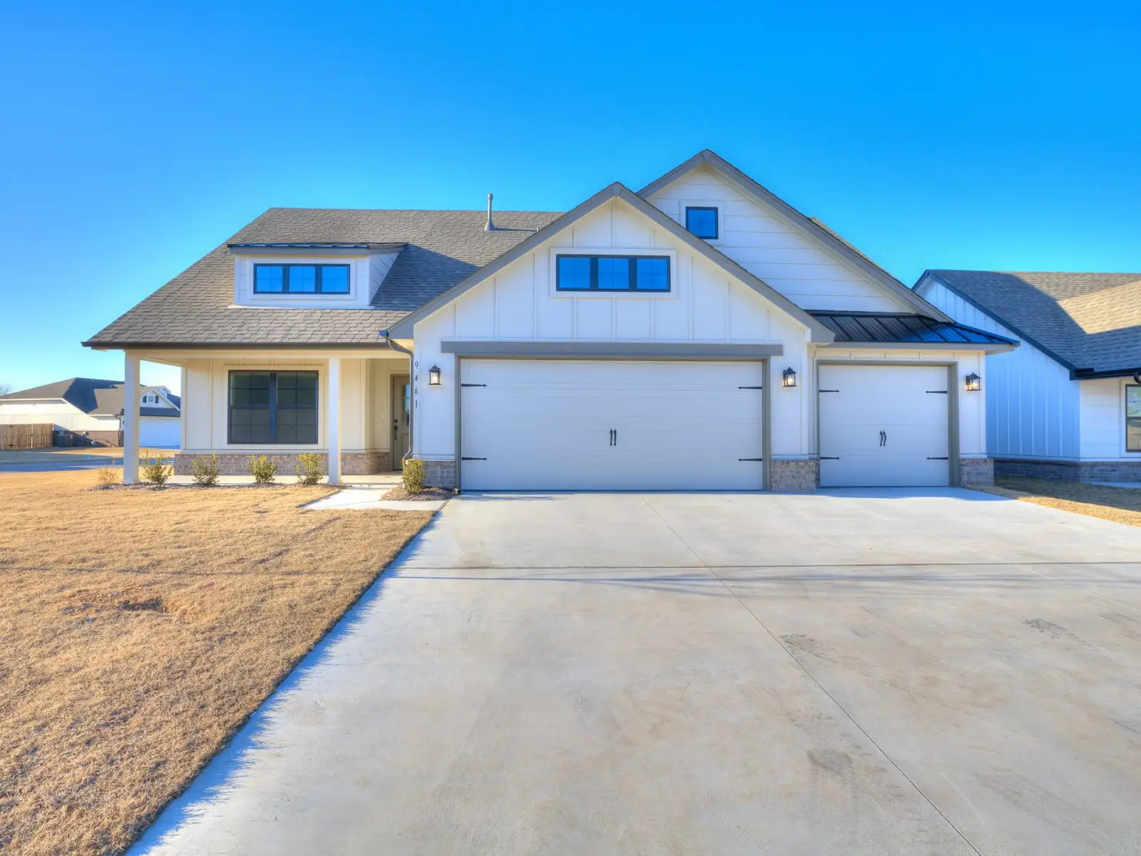 Legacy Living Tulsa rental home with attached garage and landscaped frontage