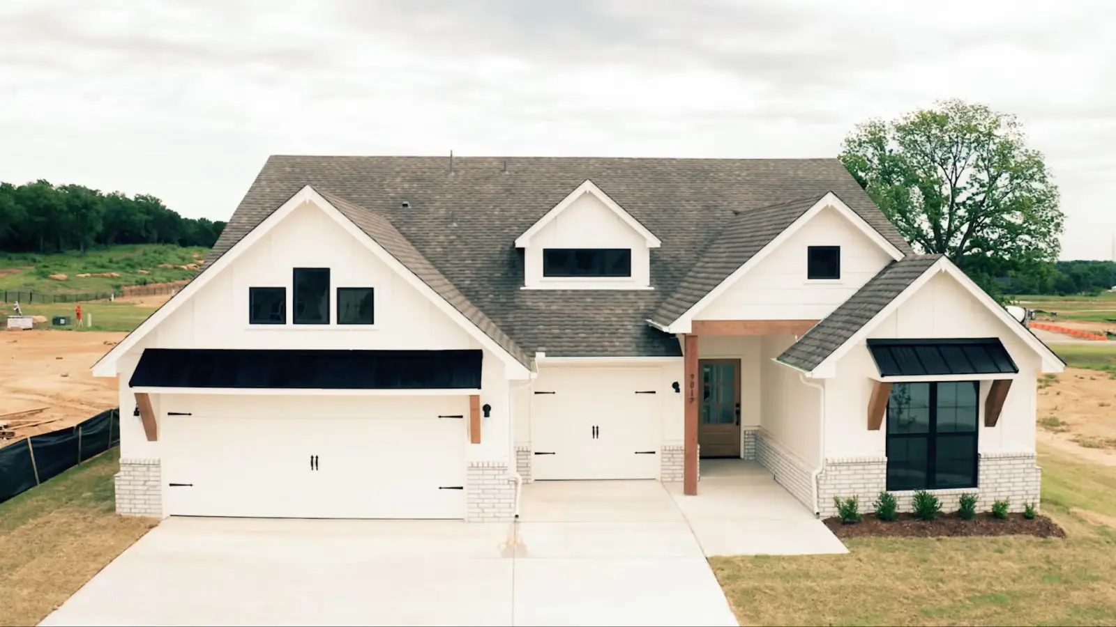Legacy Living Tulsa house exterior with welcoming front porch and windows