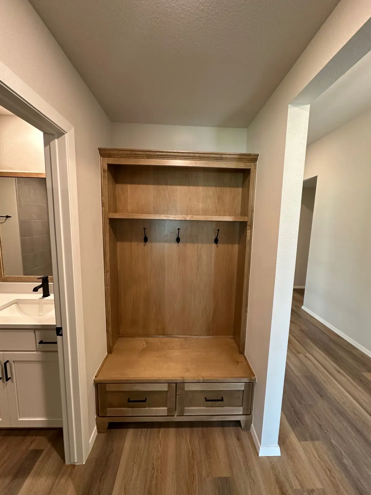 Legacy Living Tulsa rental home featuring built-in entry storage with hooks and bench